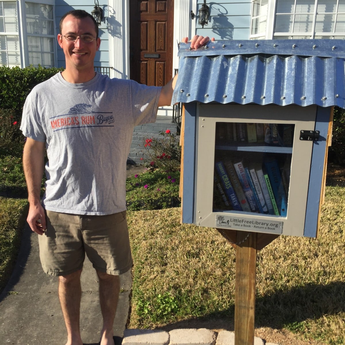 Joe Torcivia with the library box in front of his home on Woodruff.