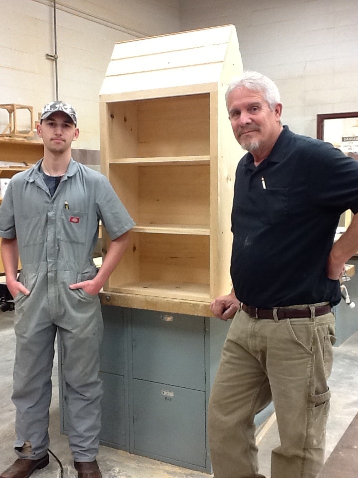 Box in progress; Barbe student David Little, left; and T&I carpentry instructor Royce Allen. 