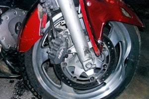 The indentation in the front of the rim was caused when the bike wheel locked on impact.