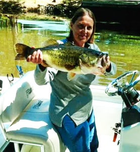 Sheryl Janet with the 7.3 pound bass she released.