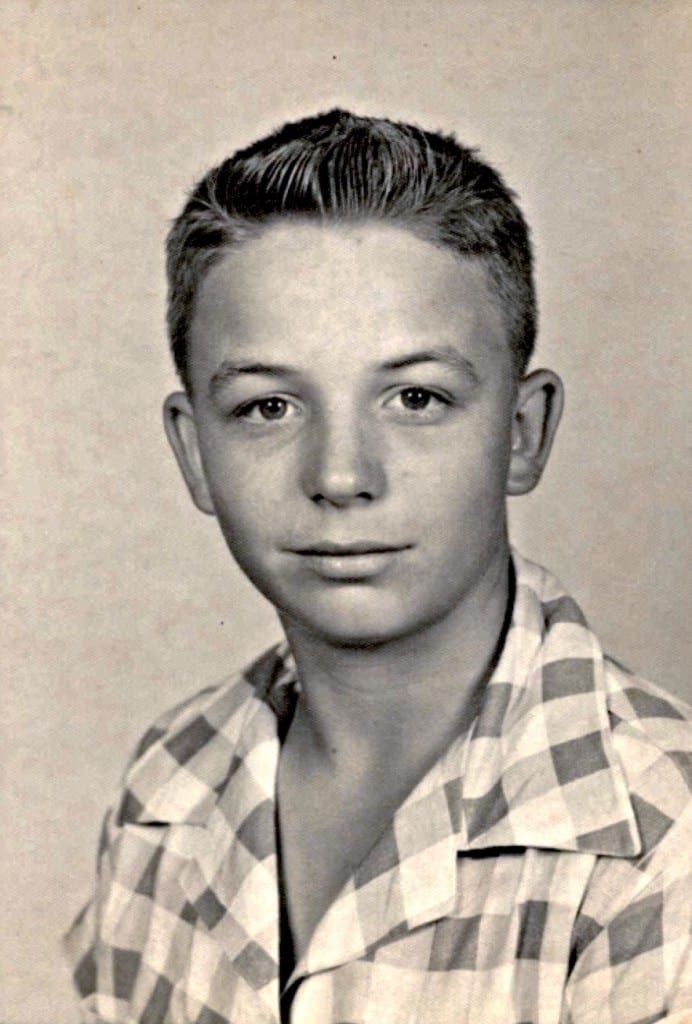 John in 1955 at the age of 15, around the time of the track meet.